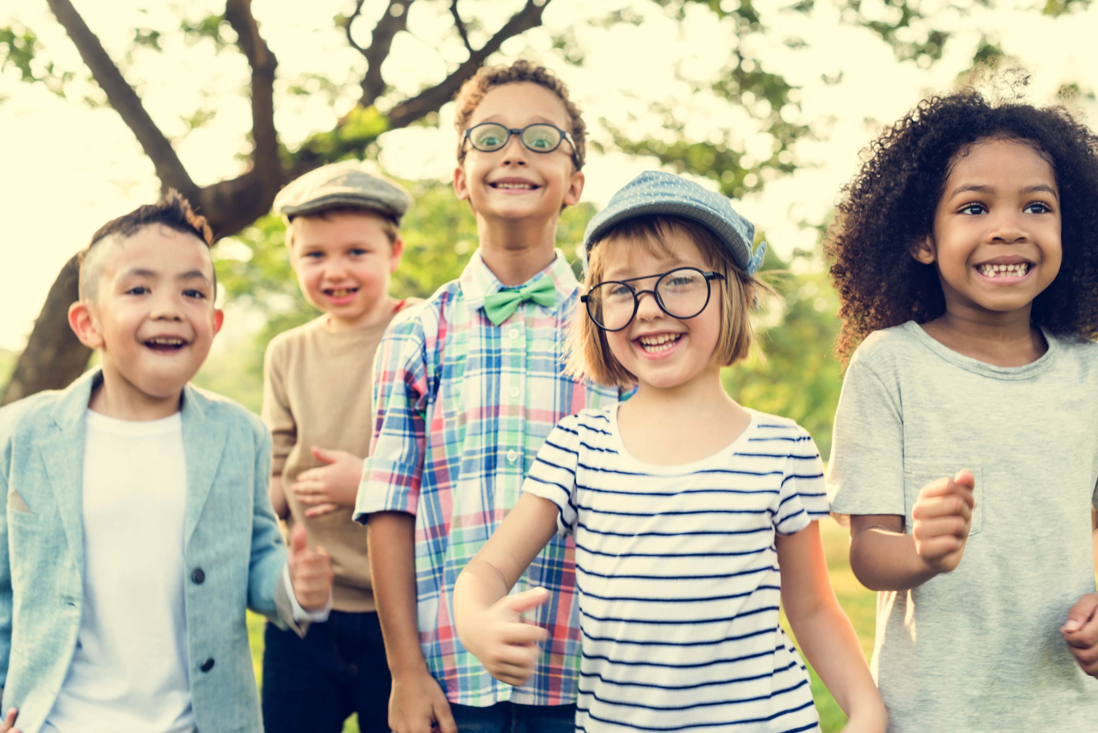 Children smiling and playing — the faces Foster Hope ND serves